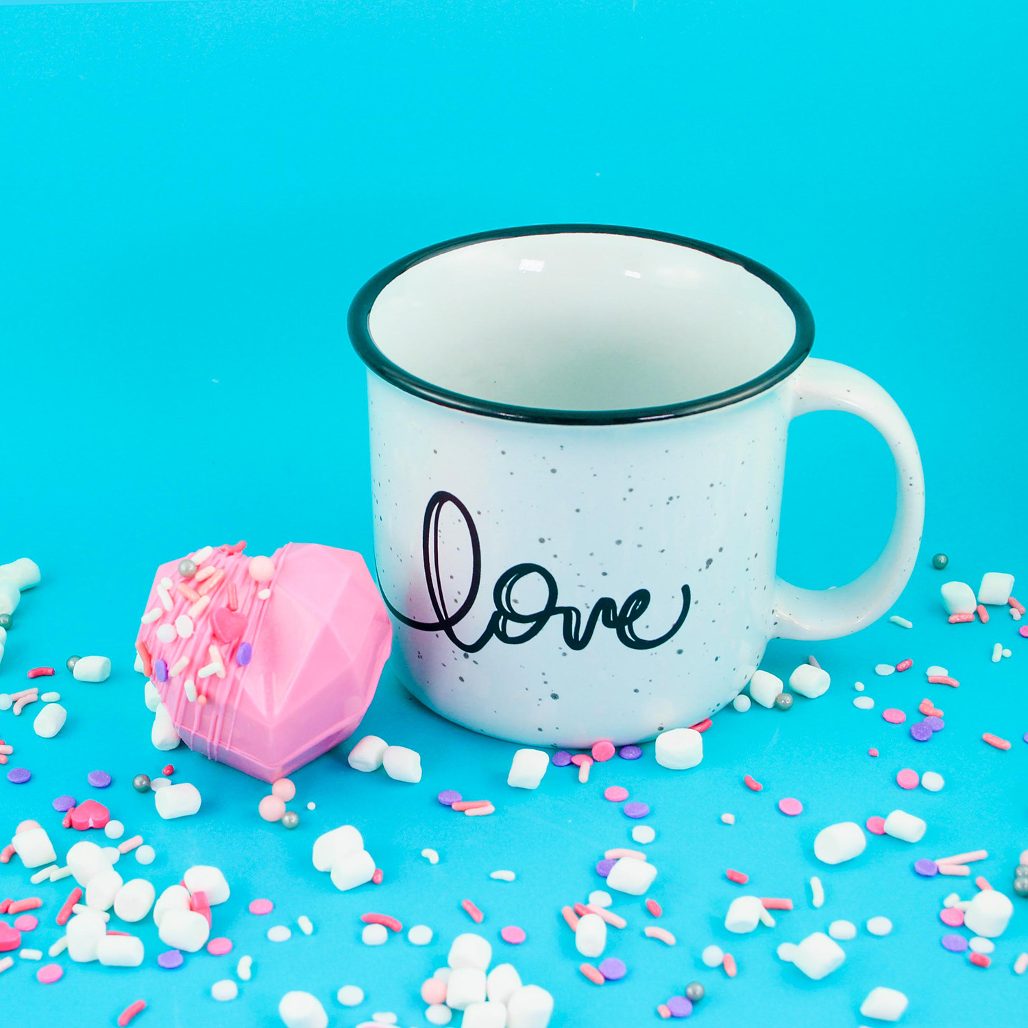 pink heart shaped hot cocoa bomb and mug