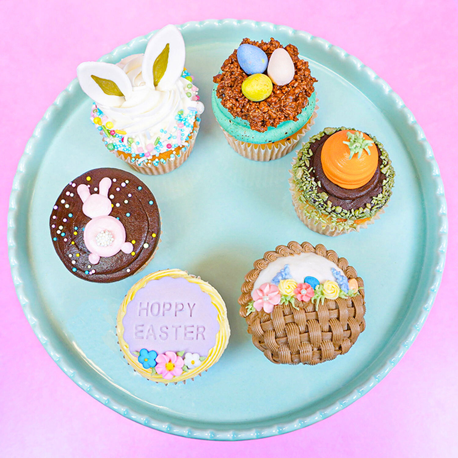 platter of easter themed cupcakes, carrot, bunnies, eggs, etc.
