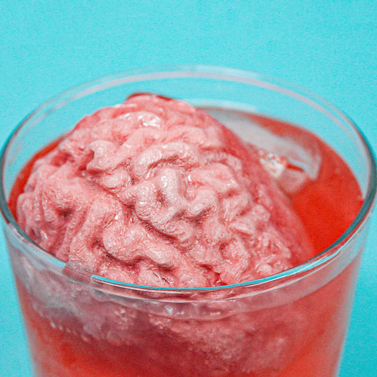 brain ice floating in red drink