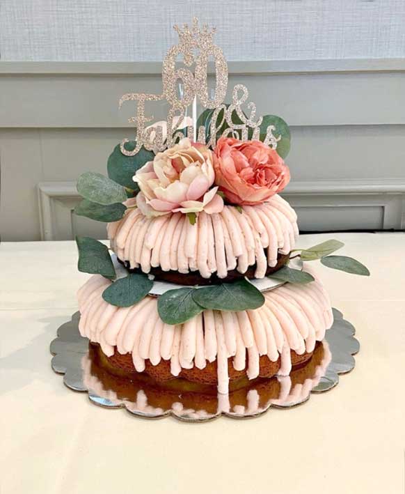 two-tiered bundt cake with flowers