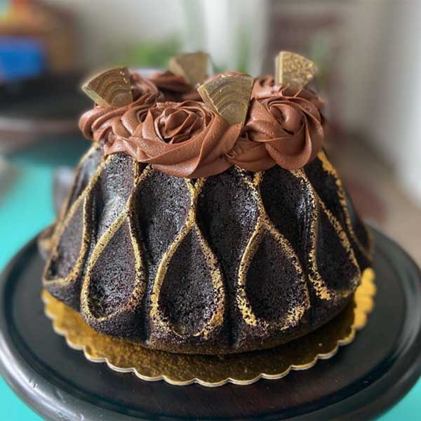 bundt cake topped with chocolate roses