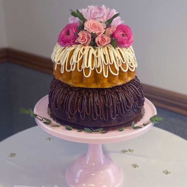 tiered bundt cake with fresh flowers