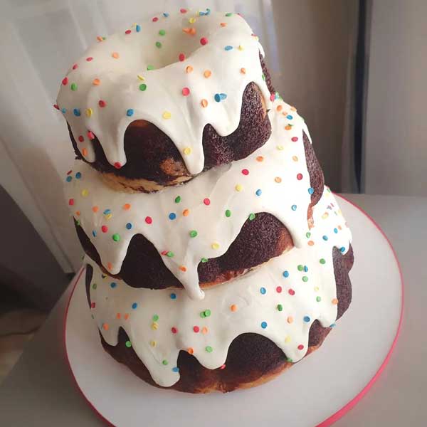 tiered birthday bundt cake with sprinkles