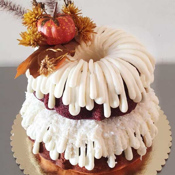 two-tier bundt cake with fall topper