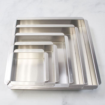 different sizes of square cake pans nested