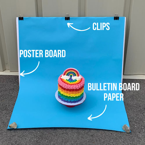 how a photography background was created with poster board, paper, and clips