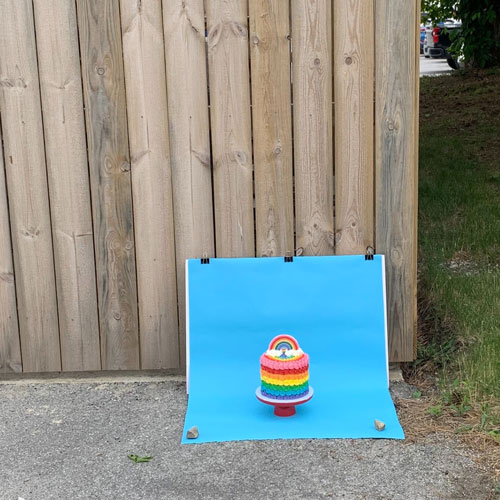 outdoor photography setup for rainbow cake