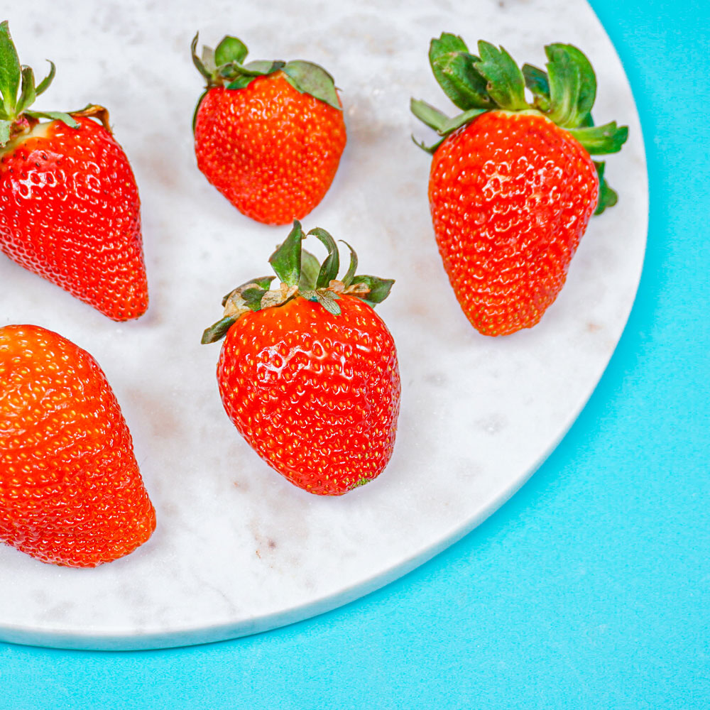 red ripe strawberries on a tray