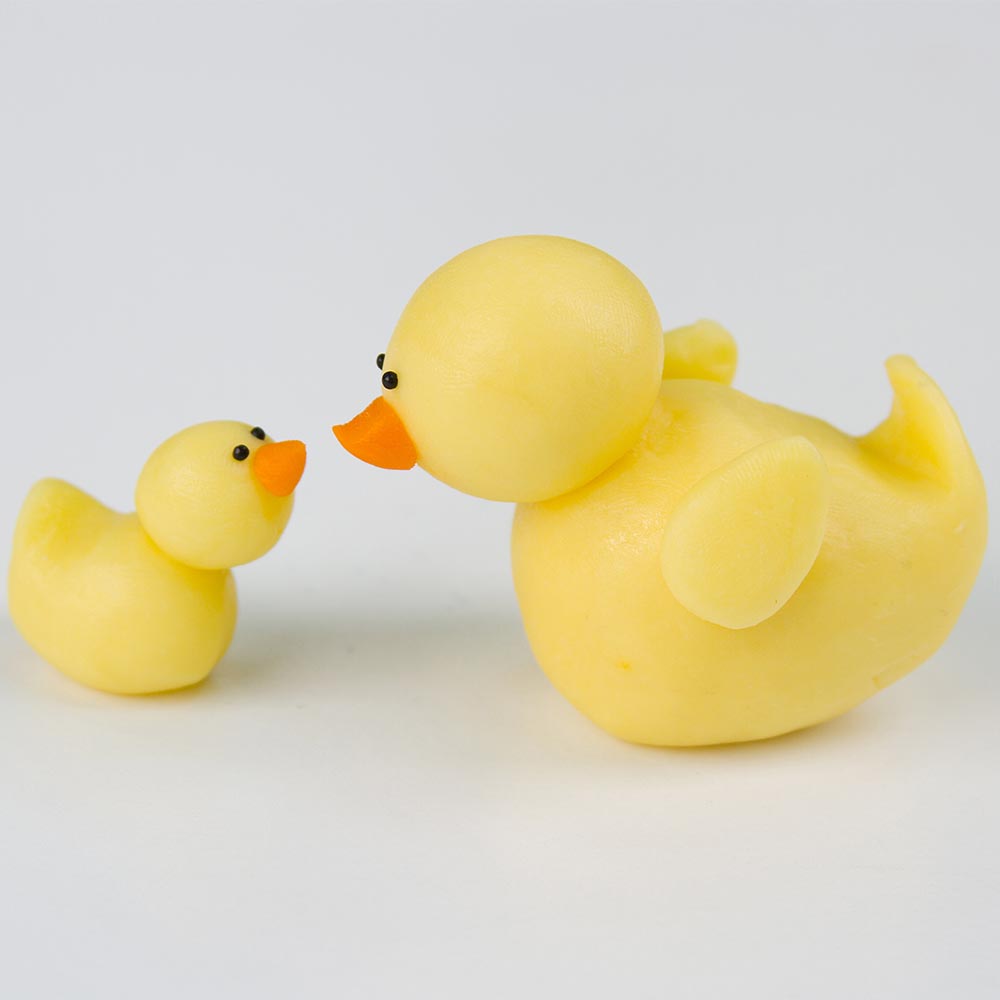 big duck and little duck molded from candy clay.