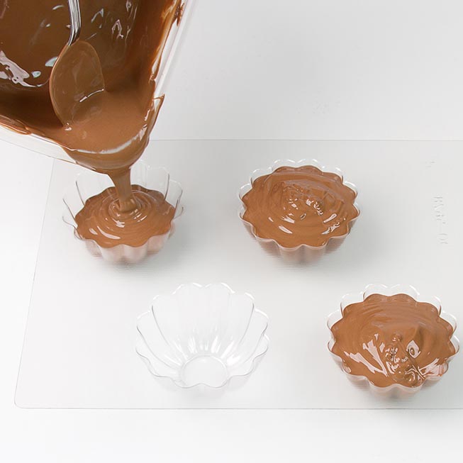 Pour metled chocolate into a clean dry mold cavity.