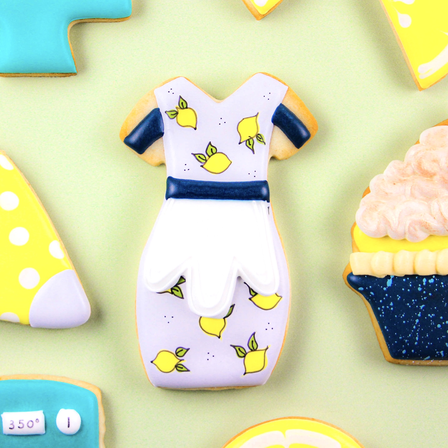 lemon apron decorated cookie in royal icing