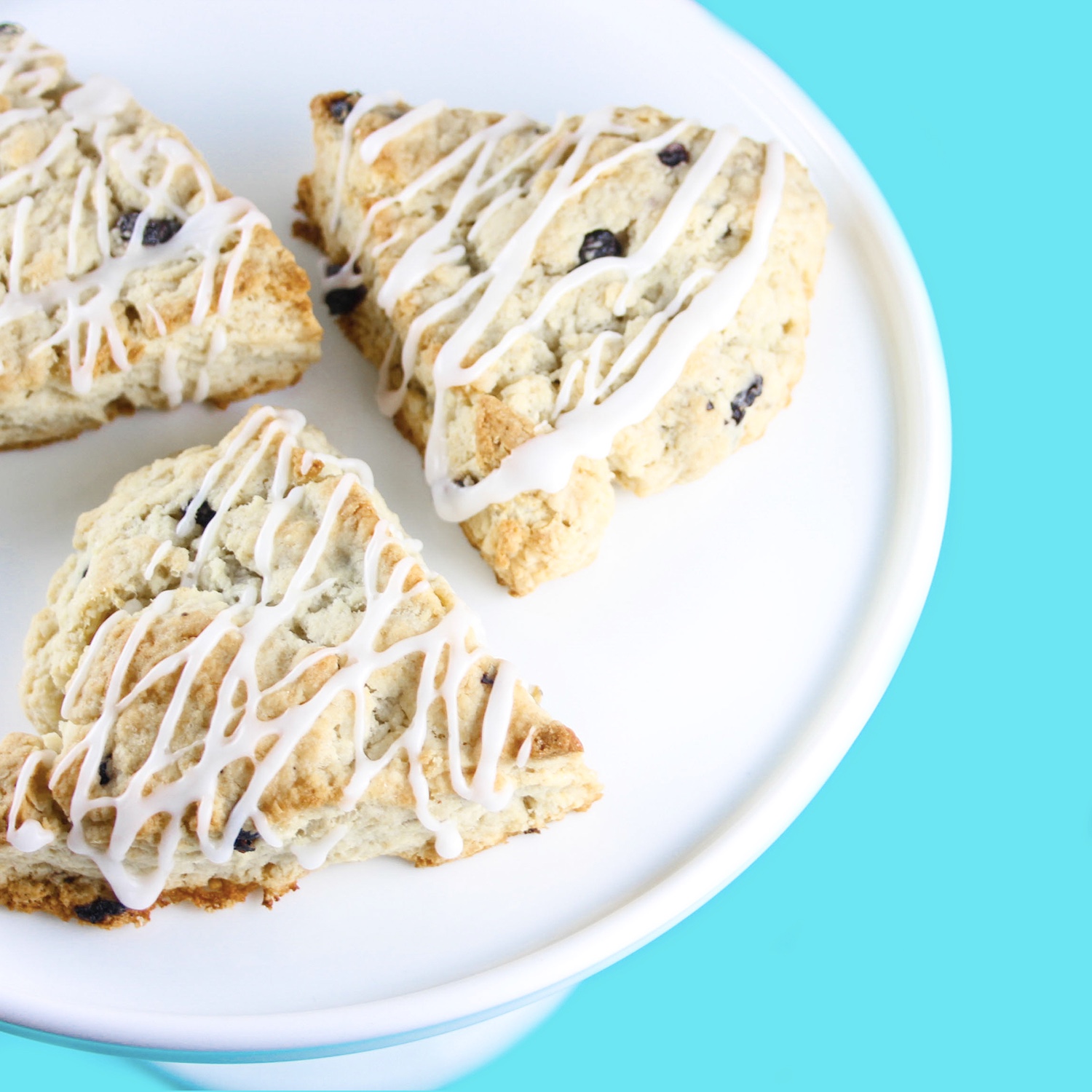 blueberry scones with lemon drizzle by sugar and crumbs