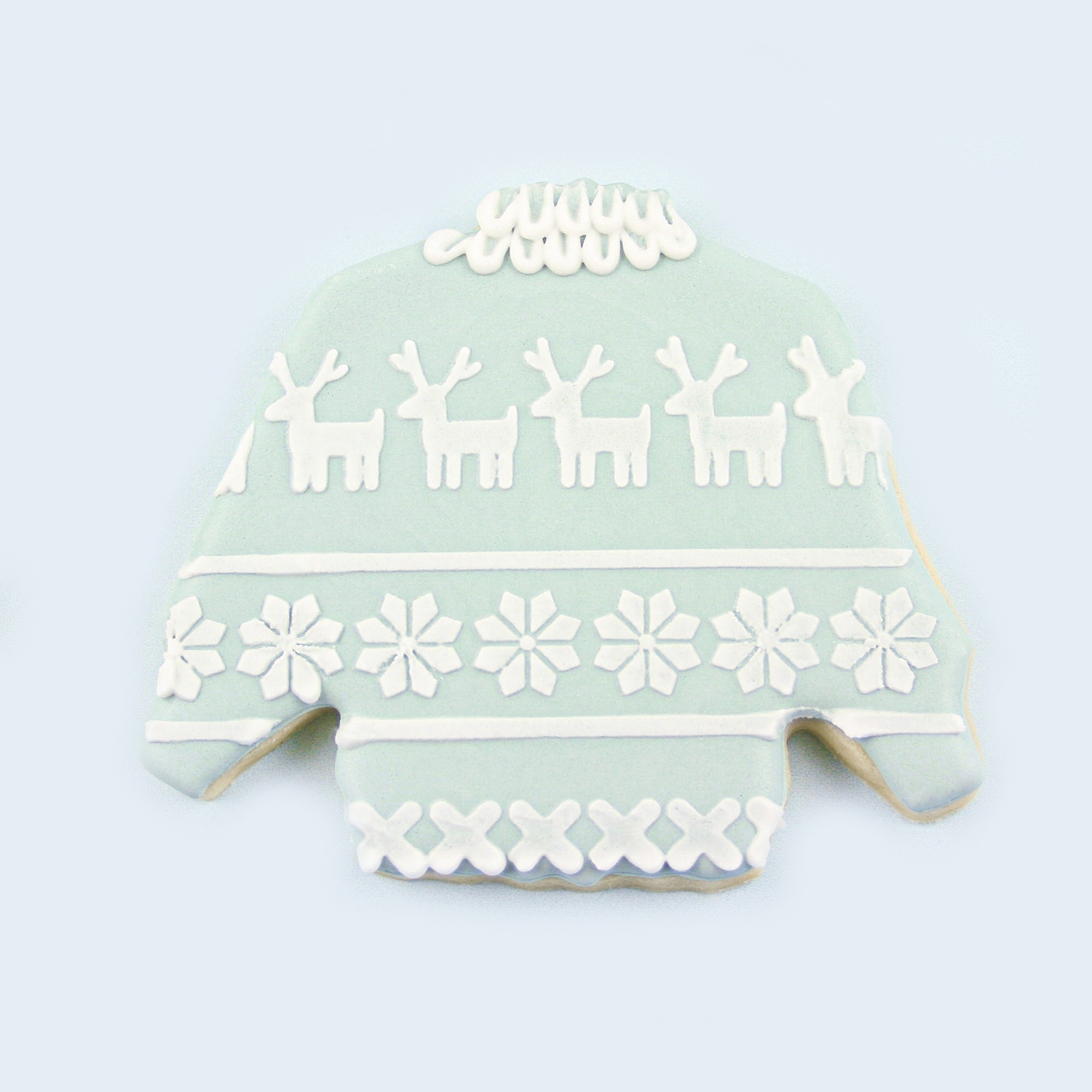 mint green sweater cookie adorned with royal icing scaped sweater stancil.