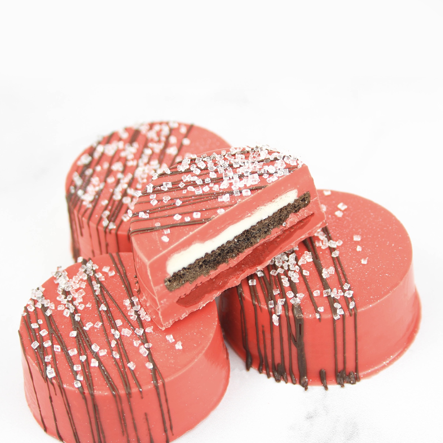 sliced red velvet chocolate dipped oreo to show interior