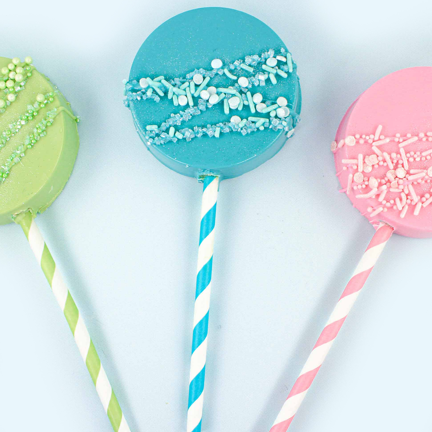 Blue Cake Pop molded sucker with blue drizzle, blue sprinkles and blue striped paper straw sucker stick