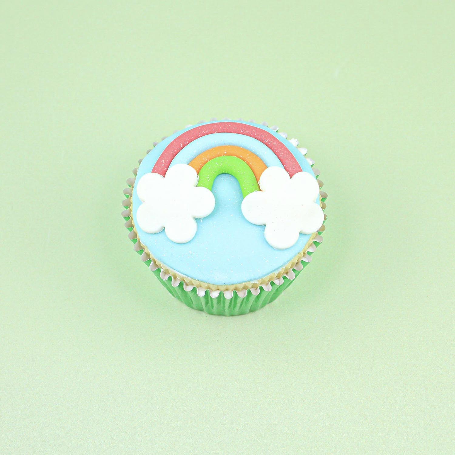 rainbow and clouds fondant decorated cupcake