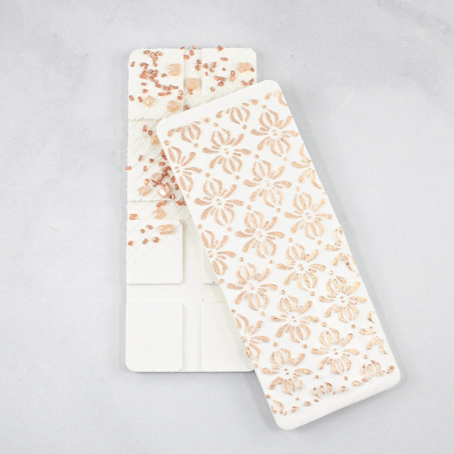 White Molded candy bar with a rose gold stencil