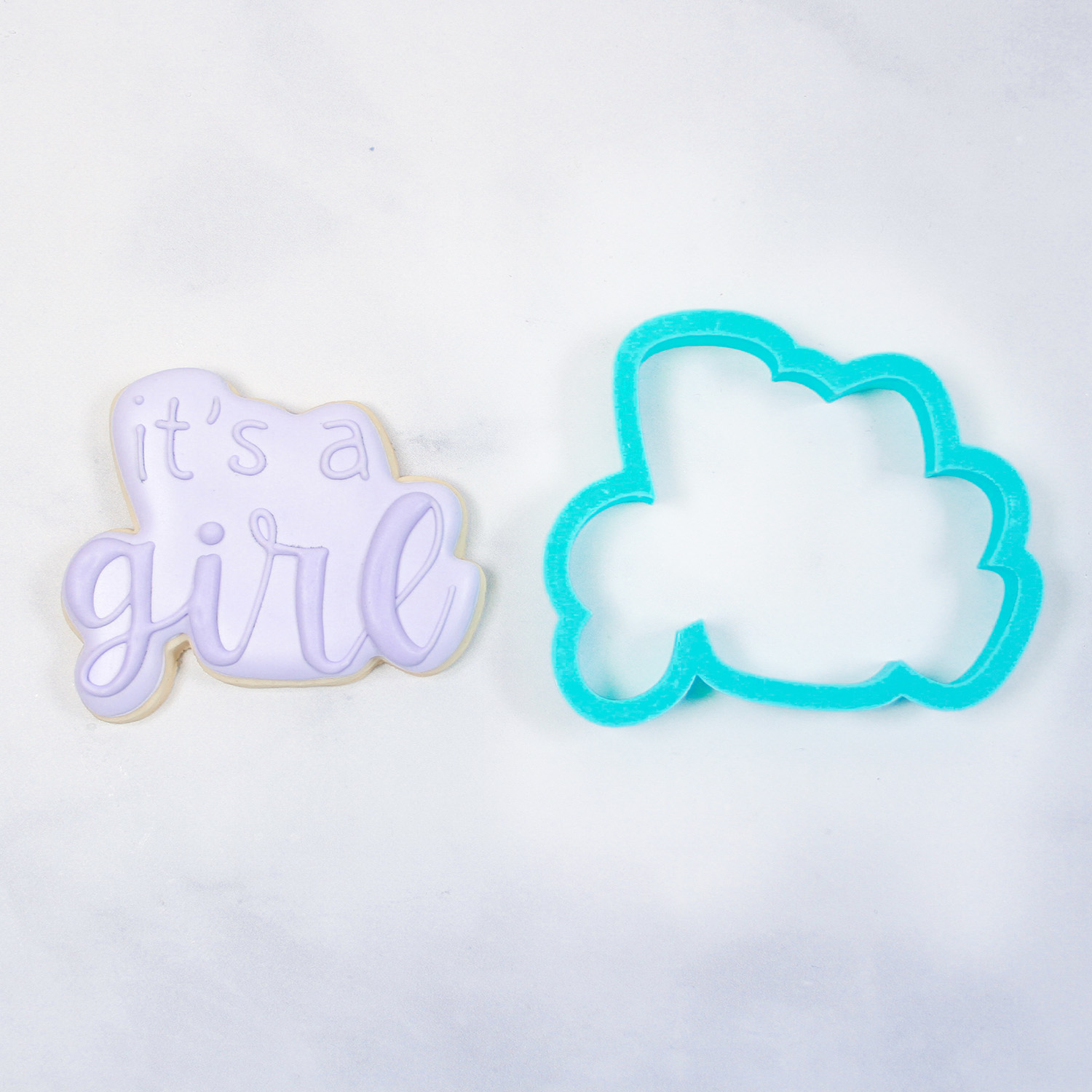 "It's a Girl" Plague Cookie decorated in light purple royal icing.