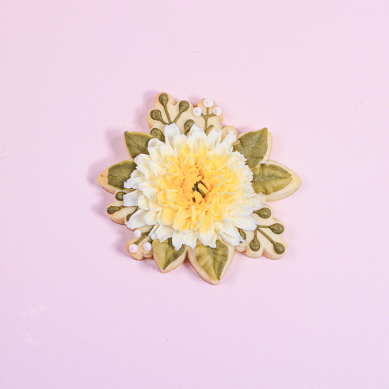 Buttercream Crysanthemum decorated cookie with leaves