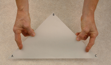 parchment triangle with corners labeled