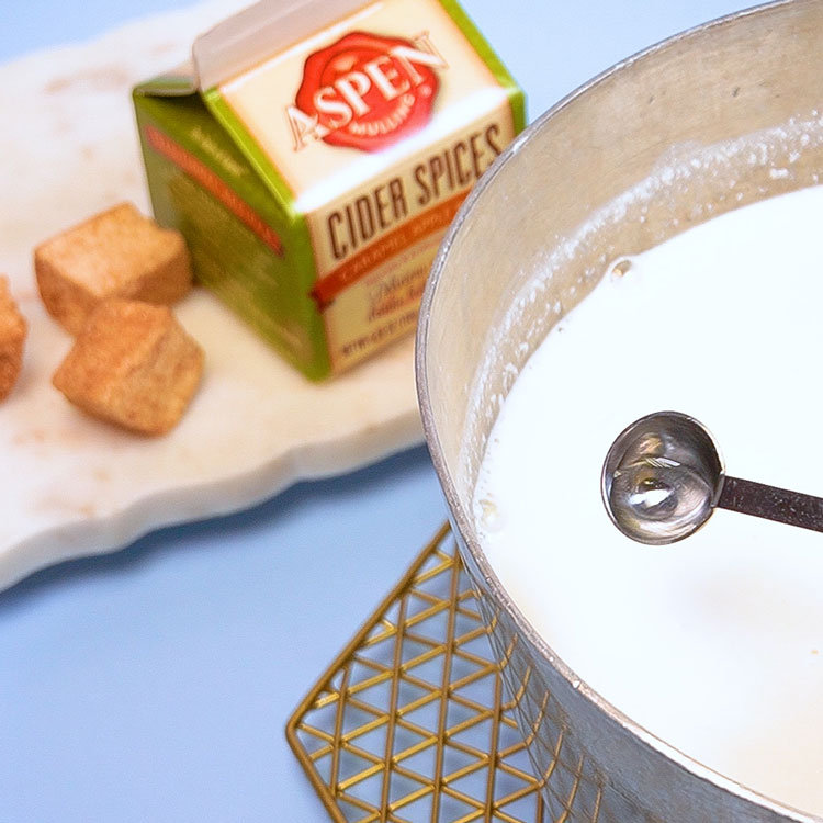 adding apple flavoring to milk mixture