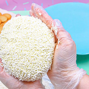 shaping cheeseball with hands