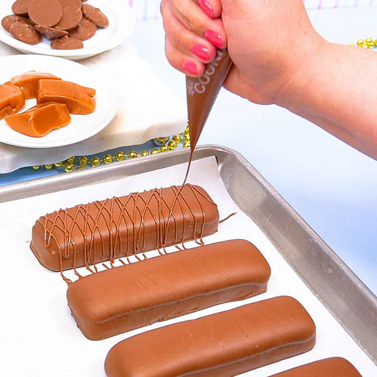 adding a drizzle to homemade candy bar