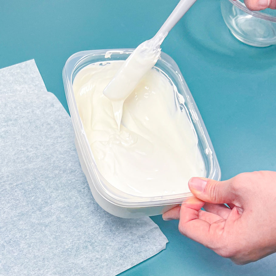 melted white candy melts in a microwave safe container