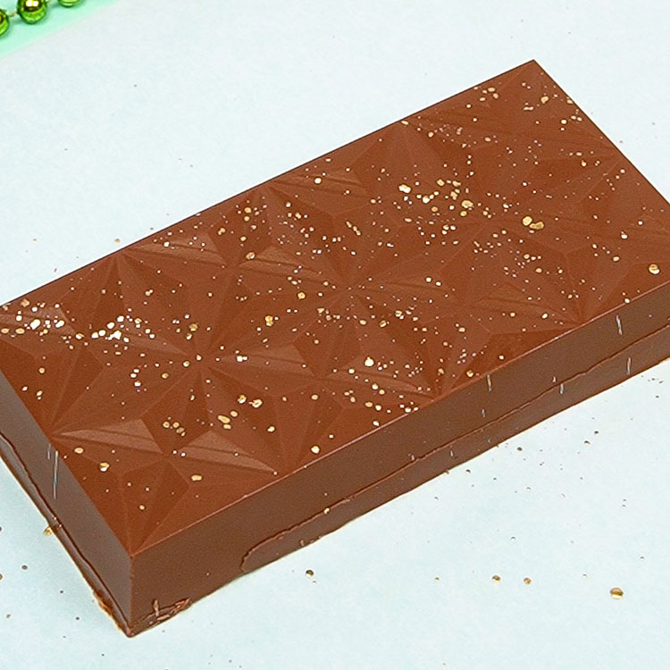 decorating dubai chocolate bar with edible gold paint