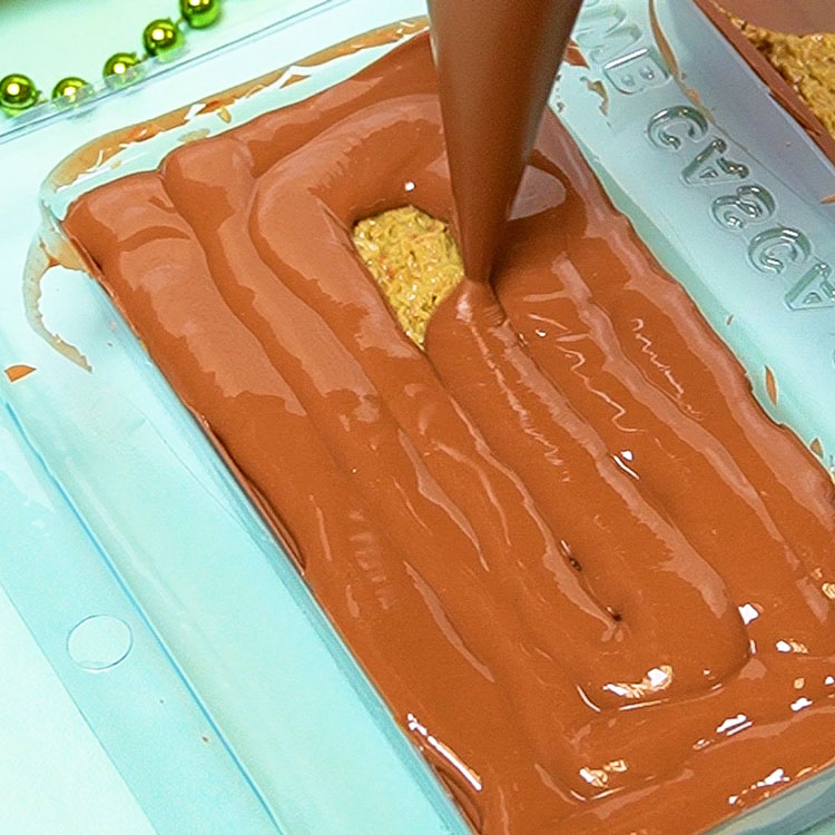 sealing dubai chocolate bar with melted milk chocolate