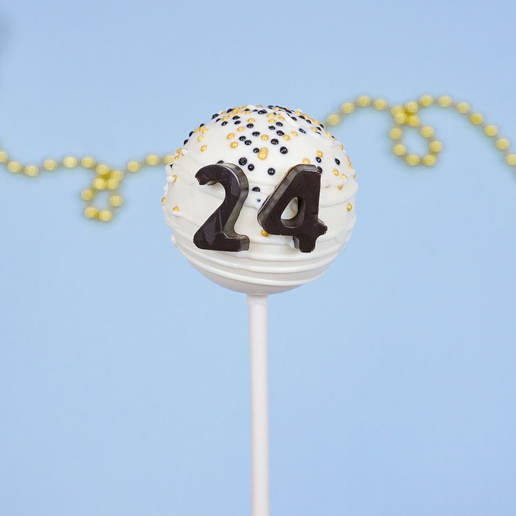 white chocolate cake pop with black chocolate numbers