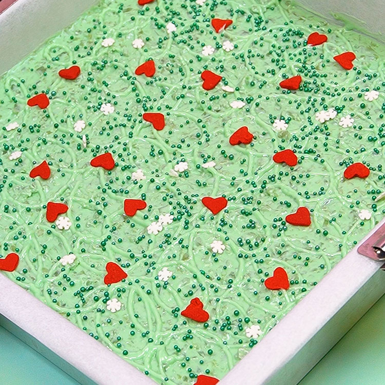 adding christmas sprinkles to chocolate bark