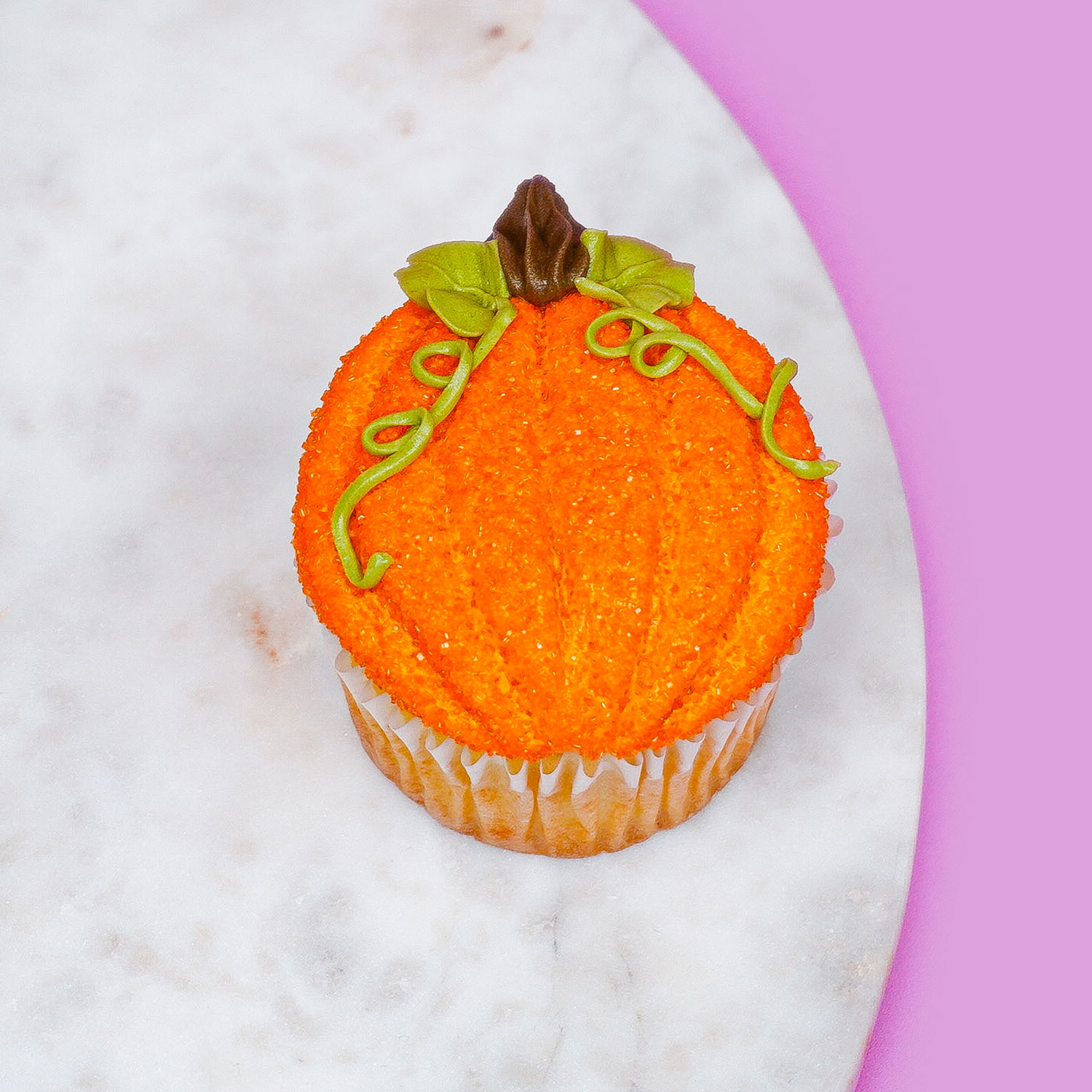 cupcake decorated to look like a pumpkin