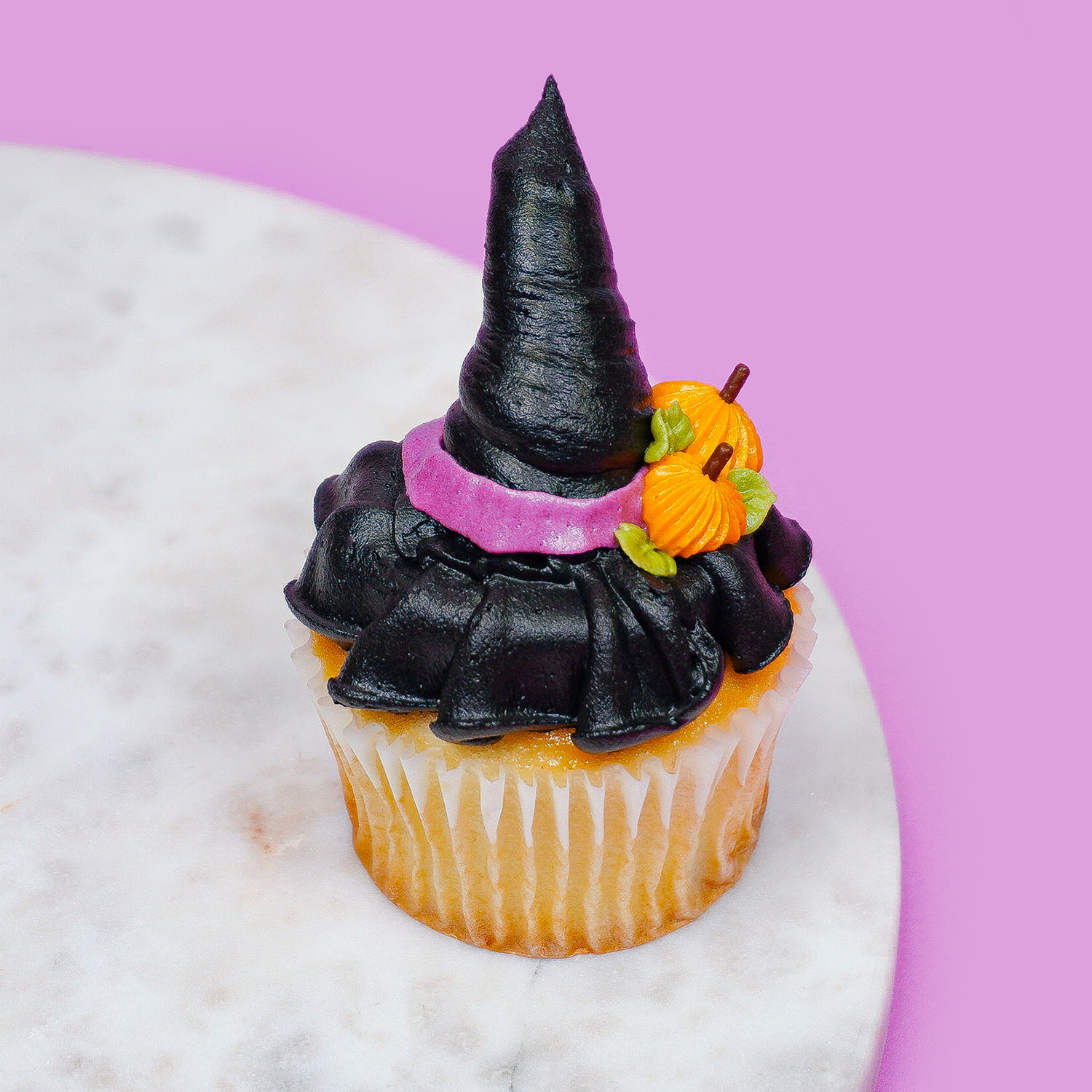 cupcake decorated to look like a witch hat