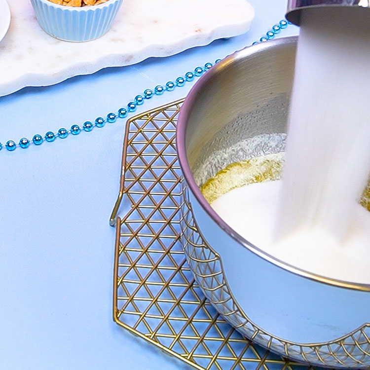 pouring sugar into saucepan