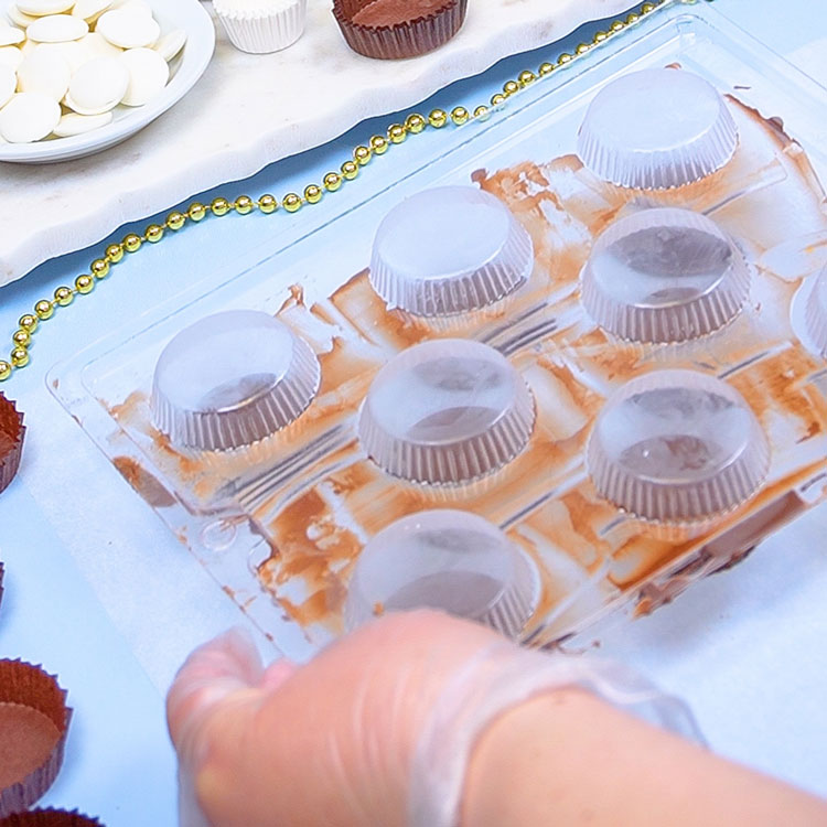 inverting chocolate mold to remove peanut butter cups