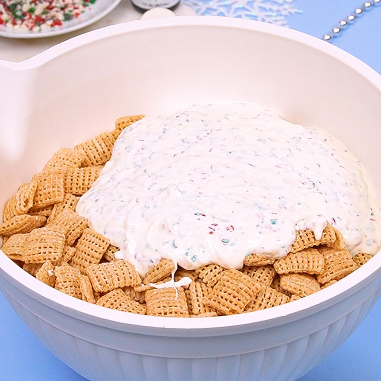 adding chocolate mixture to chex cereal