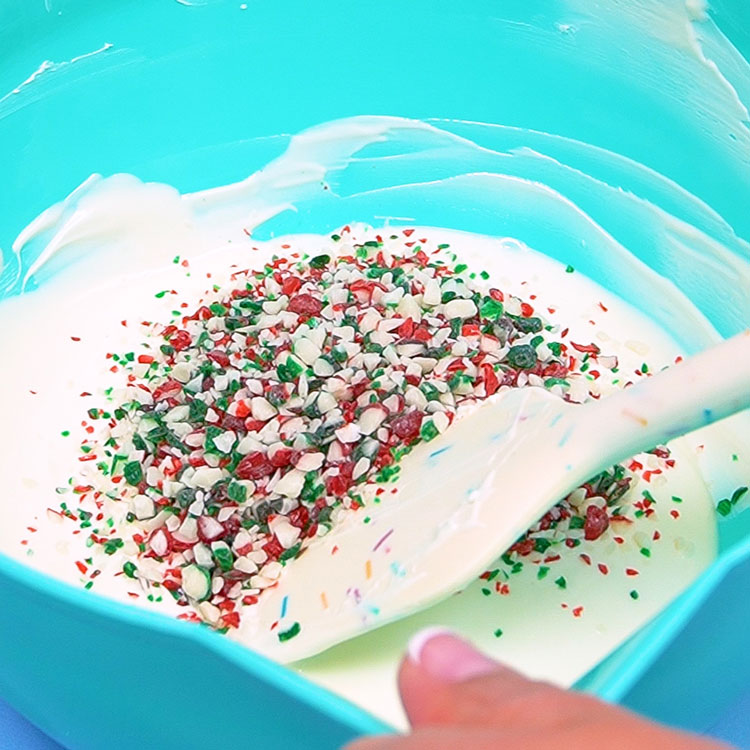 adding peppermint crunch to white chocolate