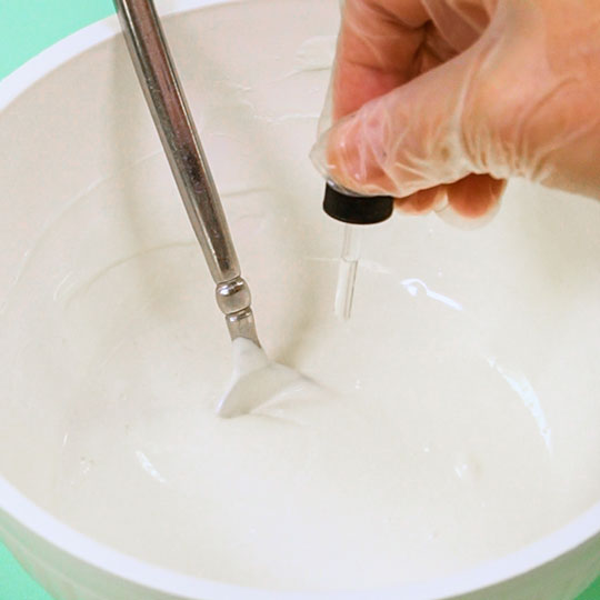 adding flavoring to melted chocolate