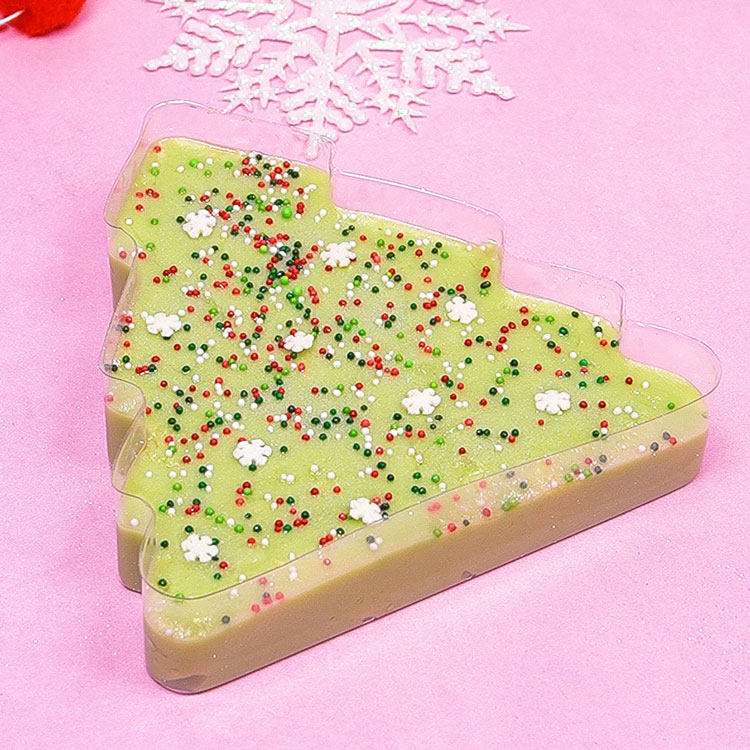 decorating pistachio fudge with christmas sprinkles