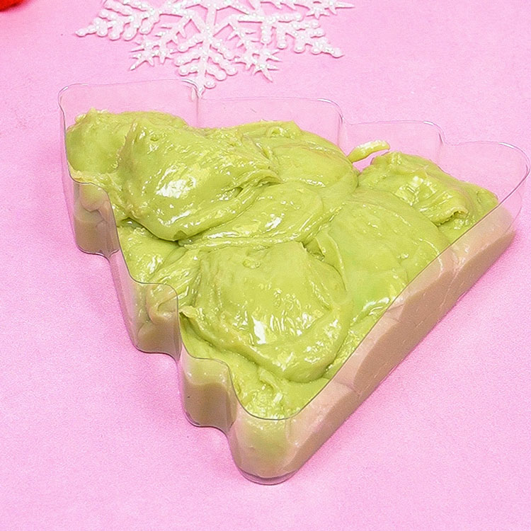 scooping fudge mixture into christmas tree box