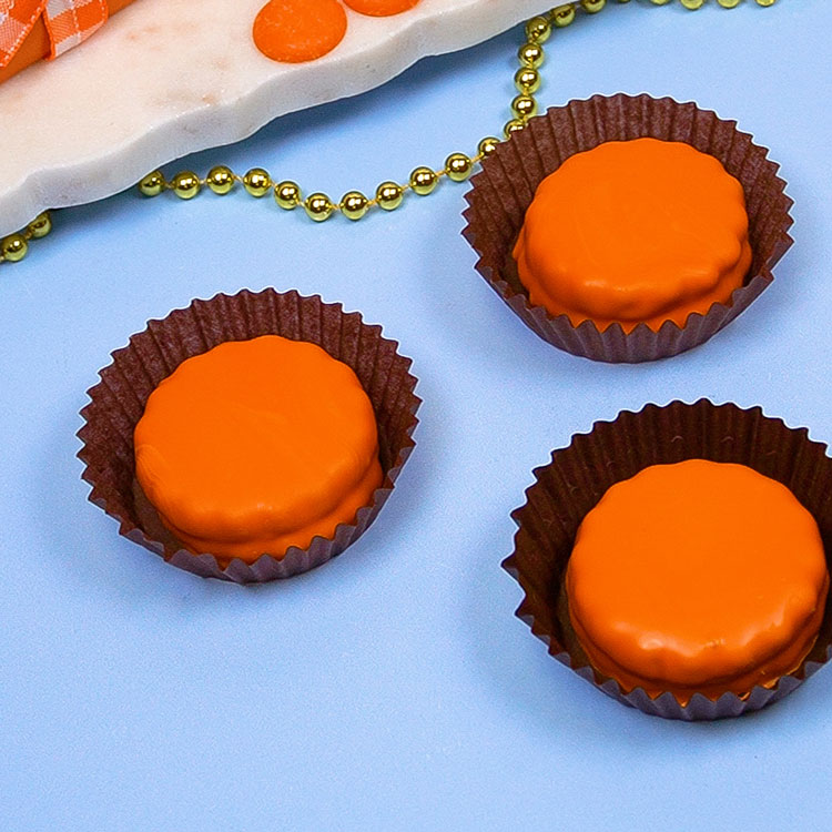 dipped cookies in brown candy cup