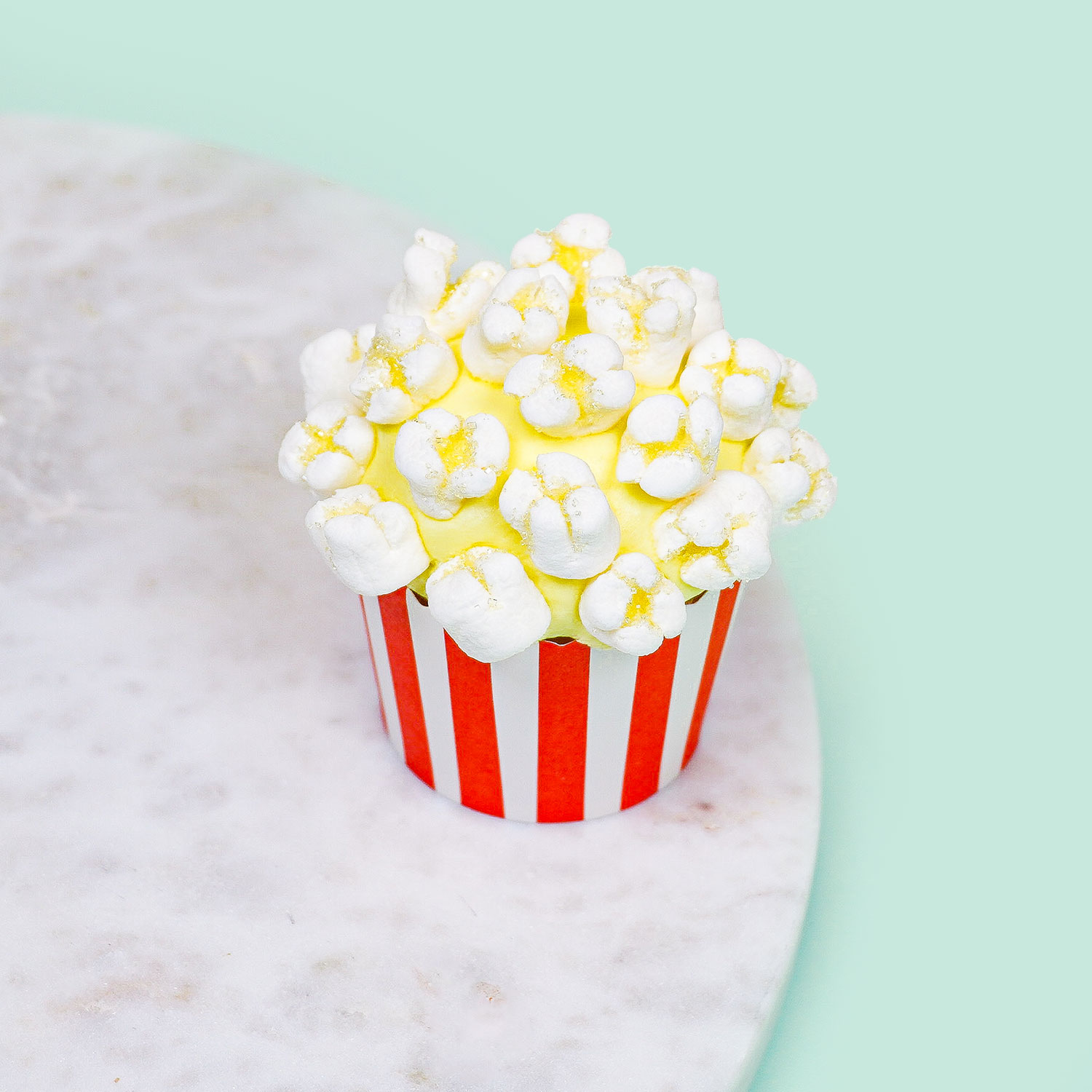 cupcake decorated to look like popcorn