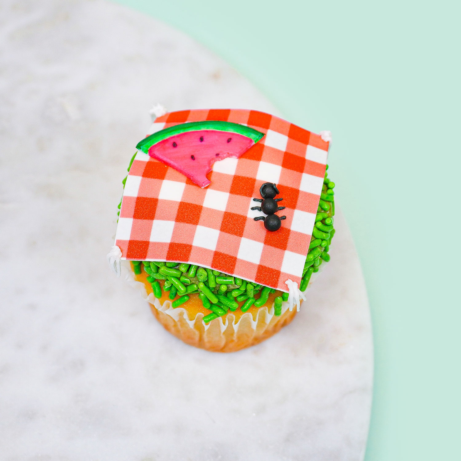 cupcake decorated to look like a picnic table