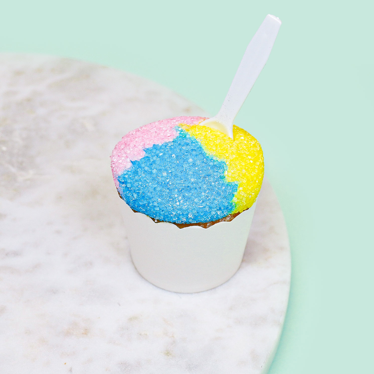 cupcake decorated to look like a snowcone